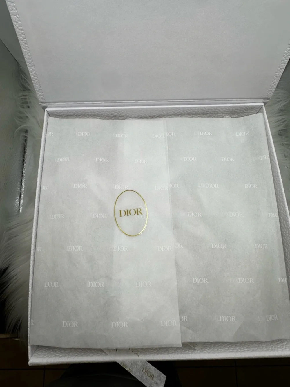 Dior White Gift Box with Gold Logo and protective wrapping inside